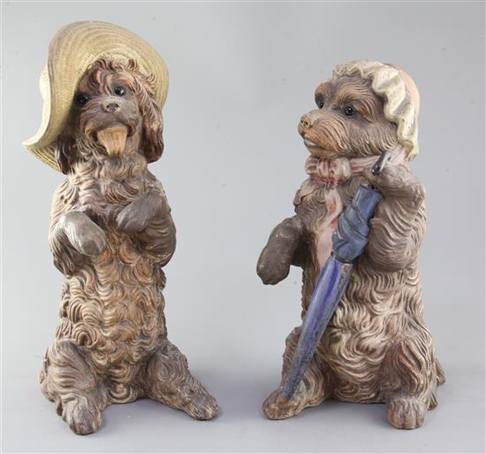 A pair of German or Austrian cold-painted terracotta figures of begging dogs, late 19th / early 20th century, 35.5cm and 32cm